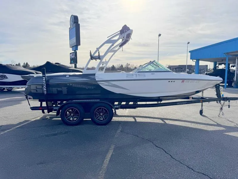 Slide: The Image of 2017 Sanger V215 XTZ boat on trailer in parking lot, side view. - 5