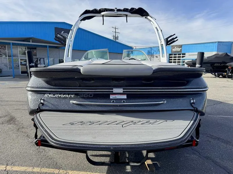 Slide: The Image of 2017 Sanger V215 XTZ boat, rear view, parked at dealership. - 7