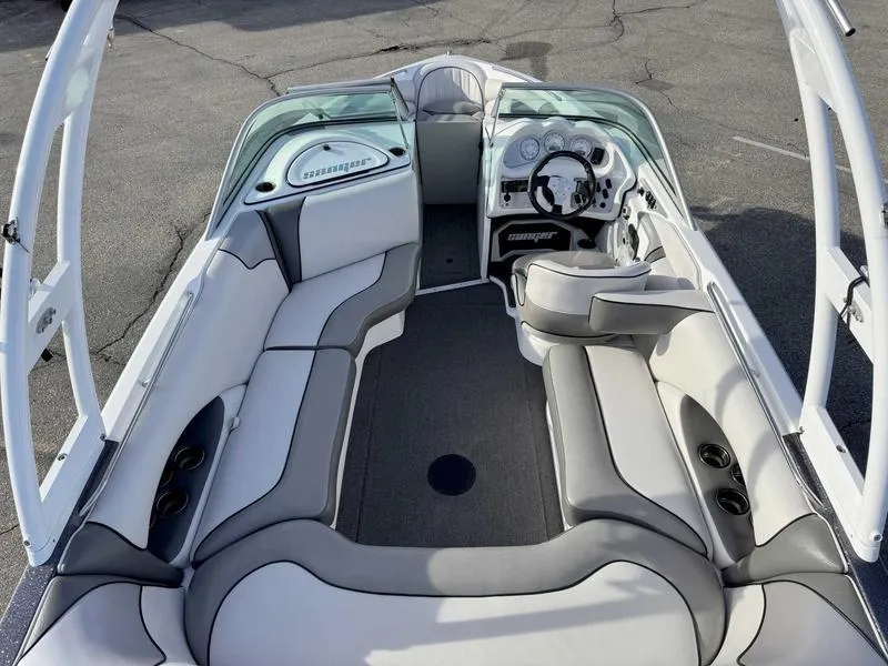 Slide: The Image of 2017 Sanger V215 XTZ boat interior with gray and white seating and steering console. - 9