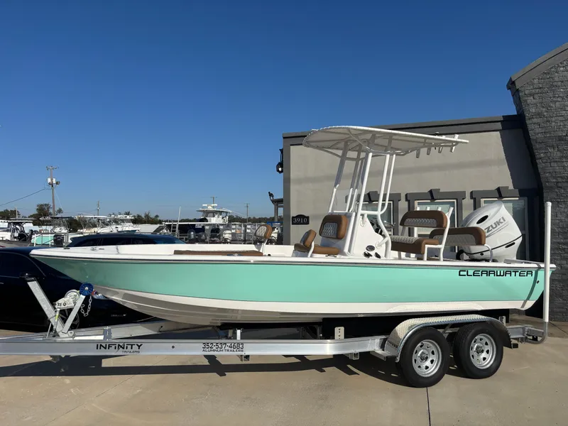 Slide: The Image of 2024 Clearwater 21 Bay boat on trailer, featuring sleek design and vibrant color. - 3