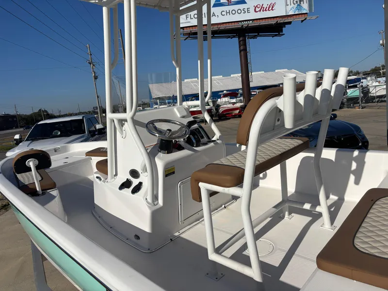 Slide: The Image of 2024 Clearwater 21 Bay boat interior with seating and steering console. - 4