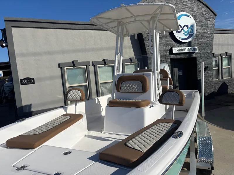 Slide: The Image of 2024 Clearwater 21 Bay boat displayed at marine sales dealership. - 6