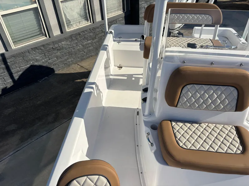Slide: The Image of 2024 Clearwater 21 Bay boat interior with quilted seats and sleek design. - 9