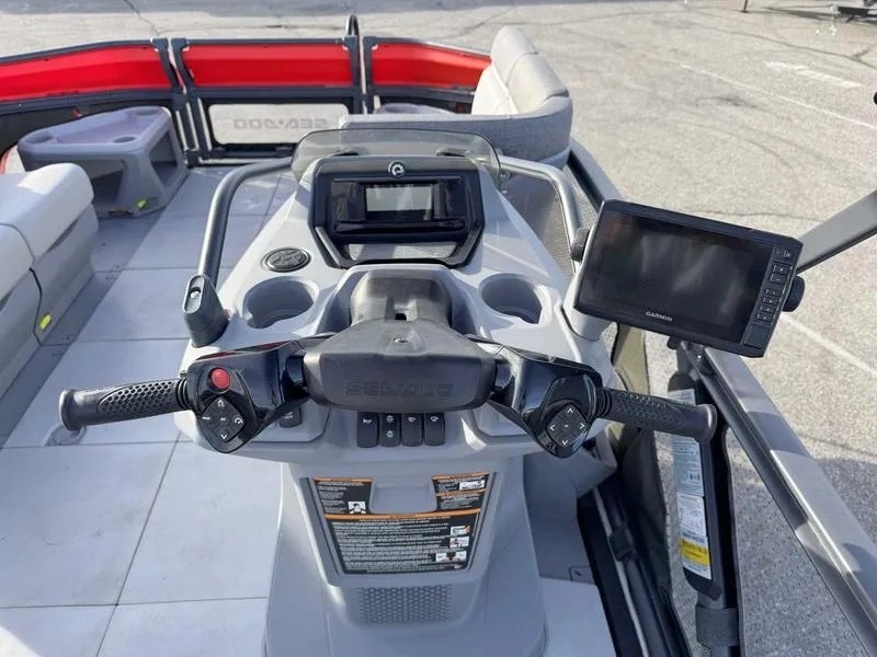 Slide: The Image of 2023 Sea-Doo Switch Cruise 18' dashboard with controls and display screens. - 11