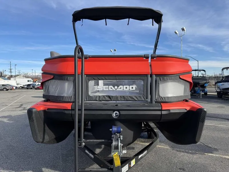 Slide: The Image of 2023 Sea-Doo Switch Cruise 18' in red, displayed on a trailer in a parking lot. - 4