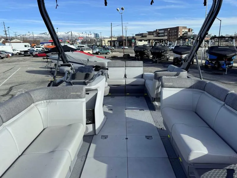 Slide: The Image of 2023 Sea-Doo Switch Cruise 18' pontoon boat with spacious seating and modern design. - 7
