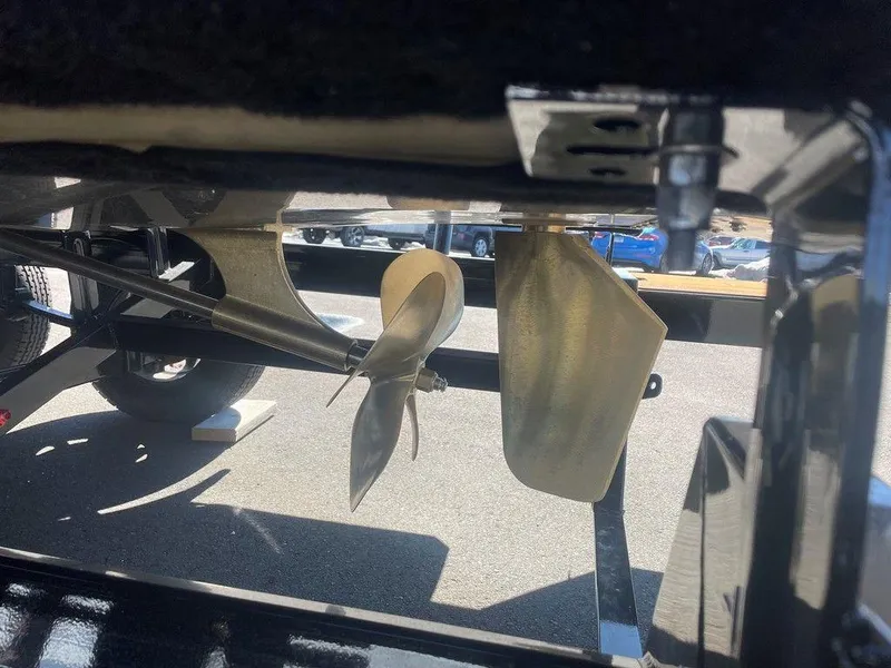 Slide: The Image of 2025 Moomba Max boat propeller and rudder detail in sunlight. - 12