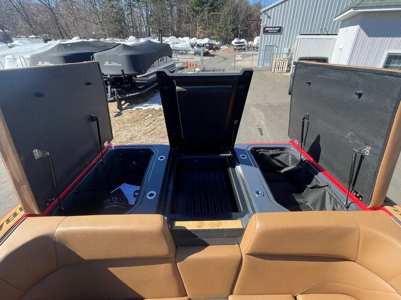 Slide: The Image of 2025 Moomba Max boat storage compartments open, showcasing spacious interior design. - 27