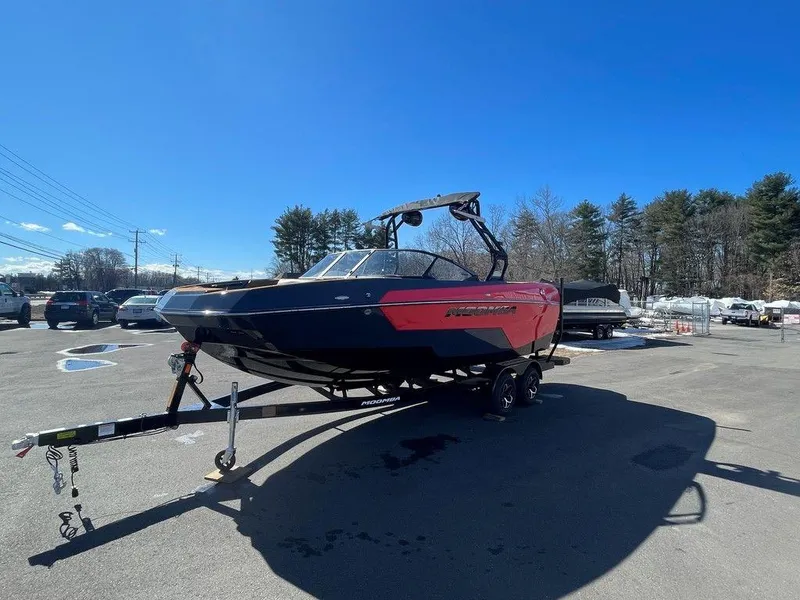 Slide: The Image of 2025 Moomba Max boat on trailer in sunny outdoor setting. - 3