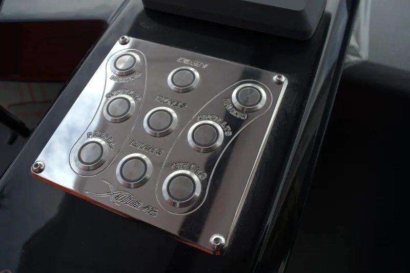 Slide: The Image of Control panel of DNA 46 model, 2025, featuring multiple labeled buttons. - 13