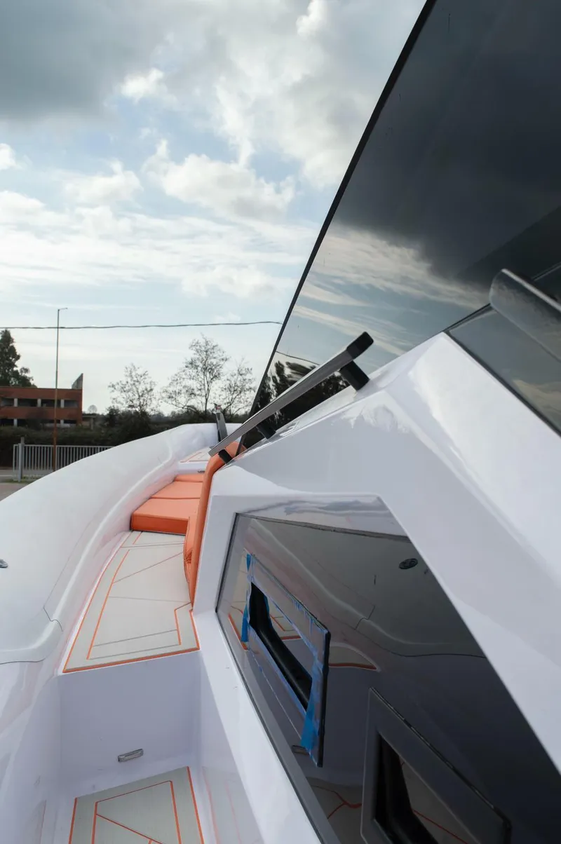 Slide: The Image of Modern DNA 46 yacht, 2025 model, featuring sleek design and luxurious deck under a cloudy sky. - 5