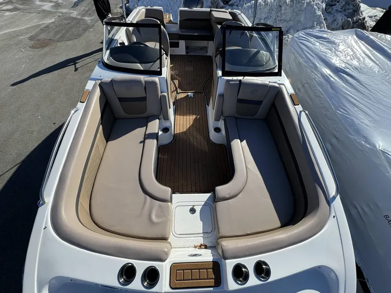 Slide: The Image of 2018 Hurricane SunDeck 217 OB boat interior with spacious seating and sleek design. - 11