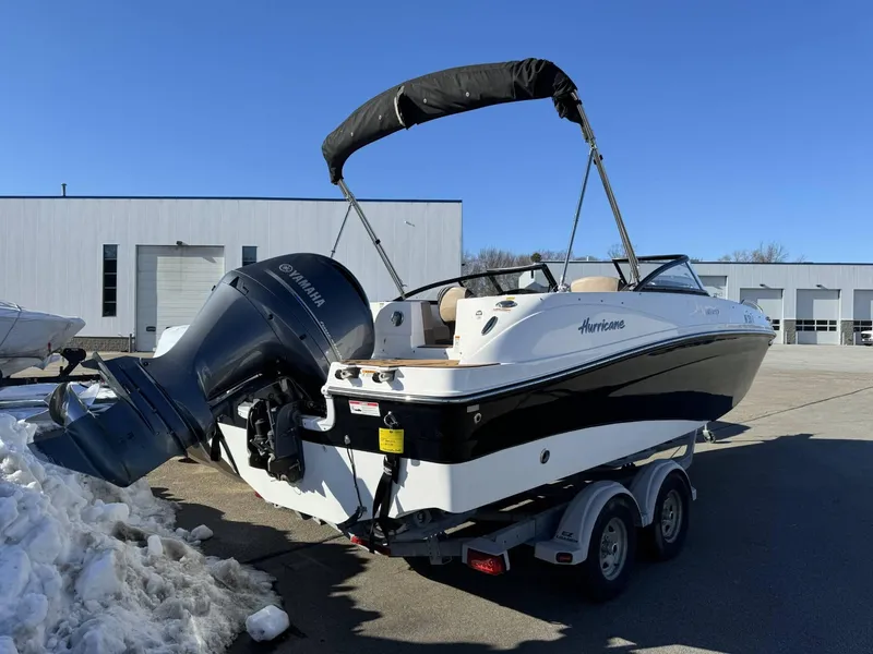 Slide: The Image of 2018 Hurricane SunDeck 217 OB boat with Yamaha outboard motor on trailer. - 4