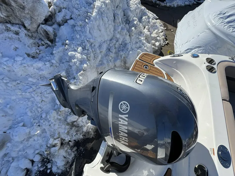 Slide: The Image of 2018 Hurricane SunDeck 217 OB with Yamaha outboard motor, surrounded by snow. - 5