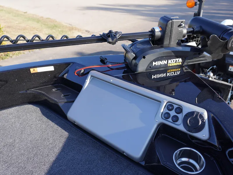 Slide: The Image of 2025 Ranger 1880MS boat dashboard with Minn Kota trolling motor and control panel. - 11