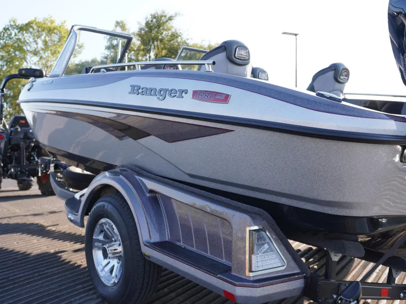 Slide: The Image of 2025 Ranger 1880MS boat on trailer, sleek design, metallic finish, outdoor setting. - 3