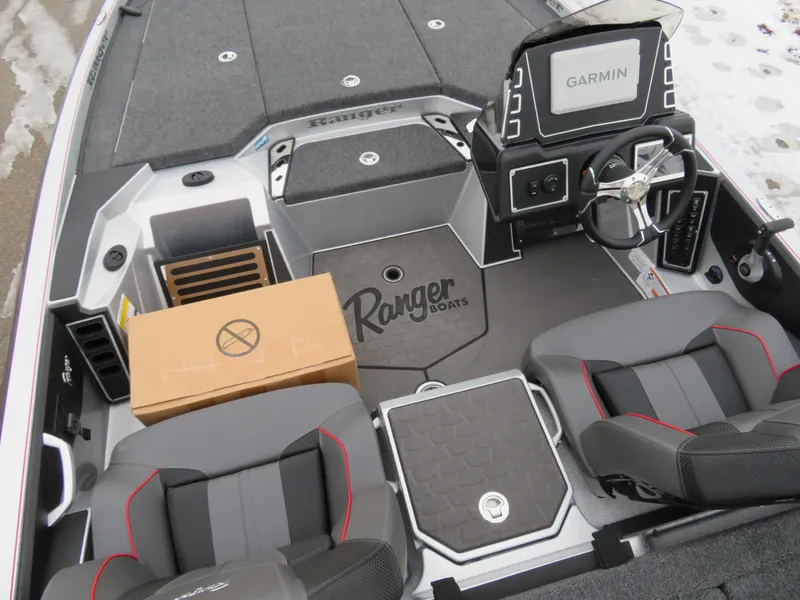 Slide: The Image of 2025 Ranger Z519R Cup-Equipped boat interior with Garmin system and seating. - 6