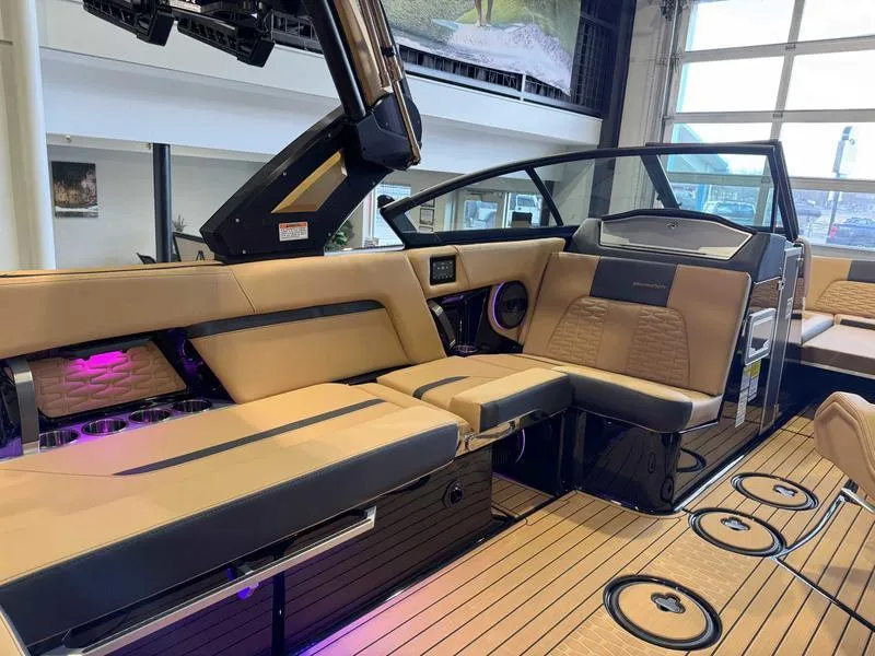 Slide: The Image of 2025 MasterCraft X24 boat interior with luxurious seating and modern design. - 10