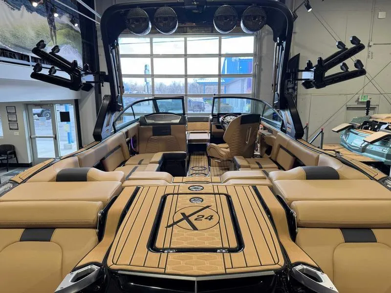 Slide: The Image of 2025 MasterCraft X24 boat interior with luxurious seating and advanced features. - 8