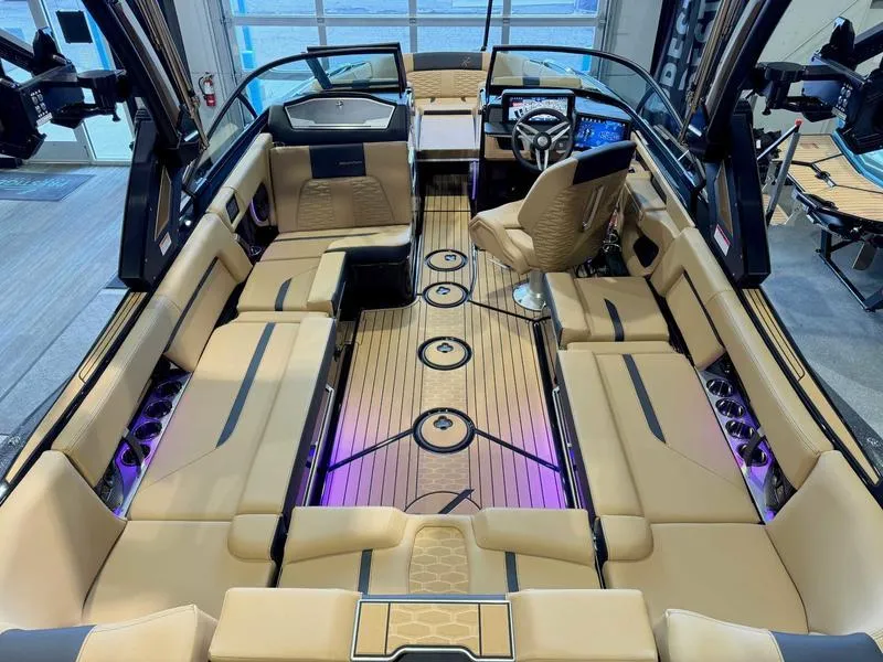 Slide: The Image of 2025 MasterCraft X24 boat interior with luxurious seating and modern design. - 9