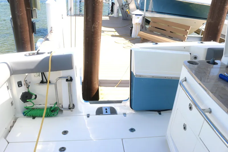 Slide: The Image of Boston Whaler 380 Outrage 2022 boat deck with seating and storage compartments. - 20