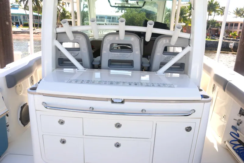 Slide: The Image of Boston Whaler 380 Outrage 2022 boat interior with seating and storage compartments. - 22