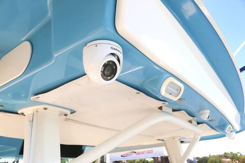 Slide: The Image of Boston Whaler 380 Outrage 2022, featuring a mounted Garmin camera on the blue hull. - 23