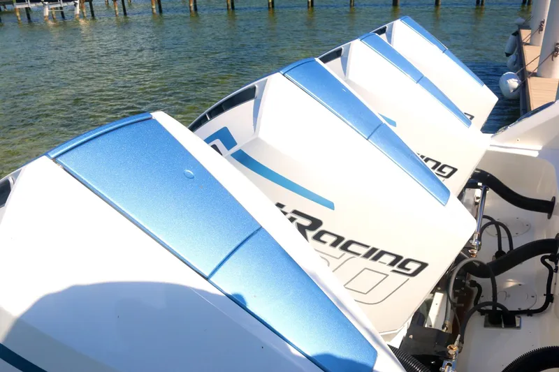 Slide: The Image of Four powerful outboard engines on a 2022 Boston Whaler 380 Outrage boat. - 7