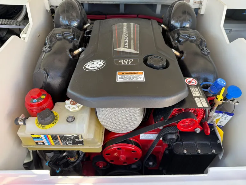 Slide: The Image of 2024 Crownline 220 SS SURF engine compartment with V8 engine and components. - 4