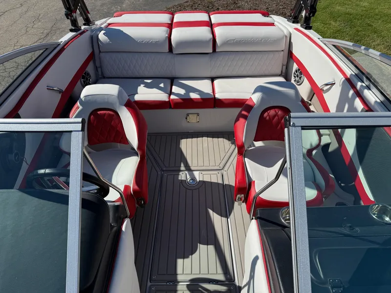 Slide: The Image of 2024 Crownline 220 SS SURF boat interior with red and white seating, sleek design. - 7