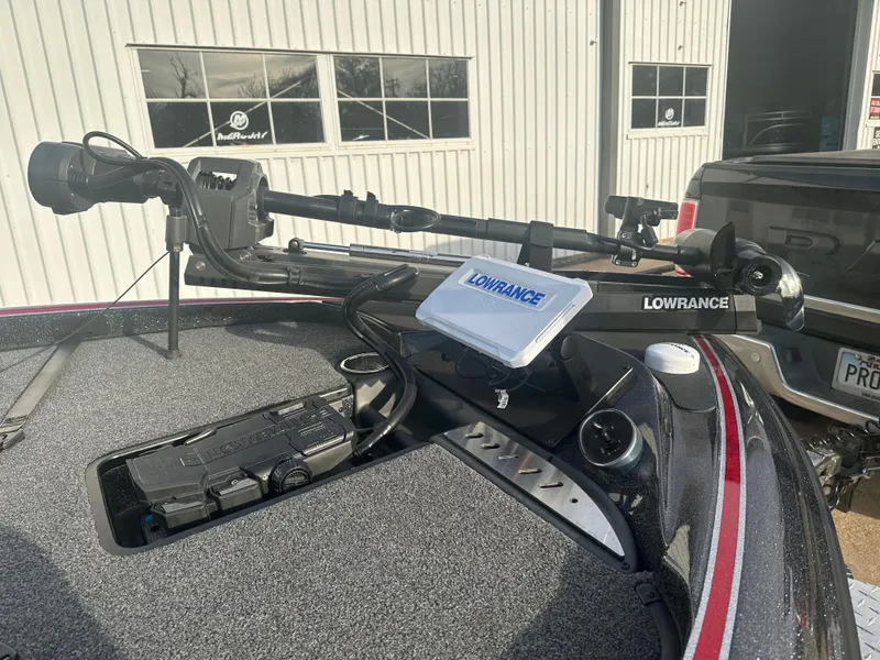 Slide: The Image of 2023 Triton 18 TrX boat with Lowrance electronics and trolling motor. - 4