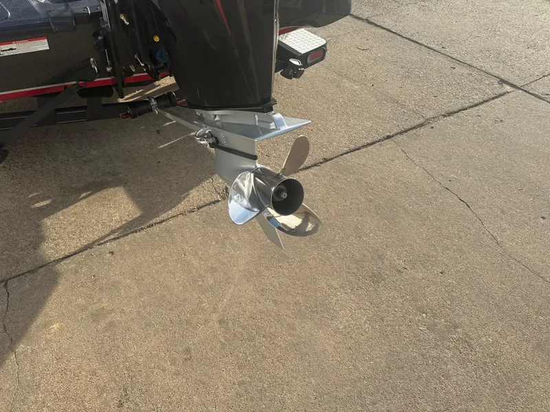 Slide: The Image of 2023 Triton 18 TrX boat propeller on concrete surface. - 8