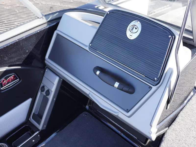 Slide: The Image of Interior of 2025 Ranger 2080MS boat, featuring sleek dashboard and storage compartment. - 10