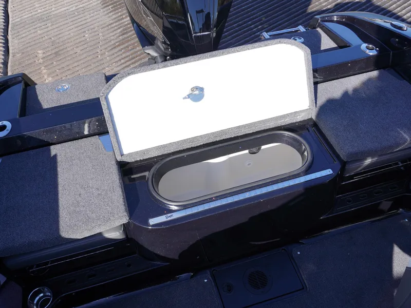 Slide: The Image of 2025 Ranger 2080MS boat storage compartment with open lid, showcasing interior space. - 12