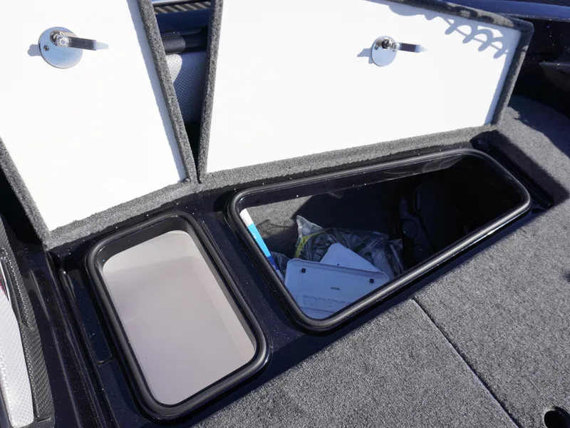 Slide: The Image of Open storage compartments in a 2025 Ranger 2080MS boat, showcasing interior space. - 15