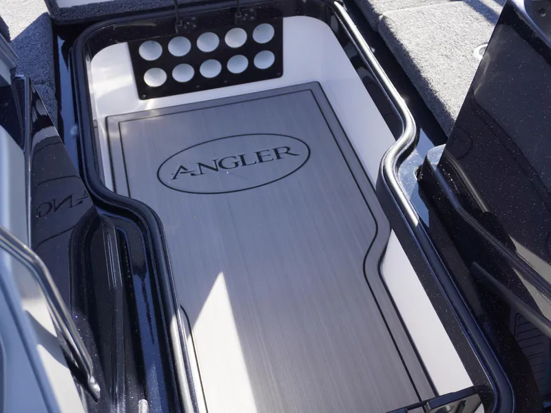 Slide: The Image of Ranger 2080MS 2025 boat storage compartment with "Angler" logo, featuring organized rod holders. - 17