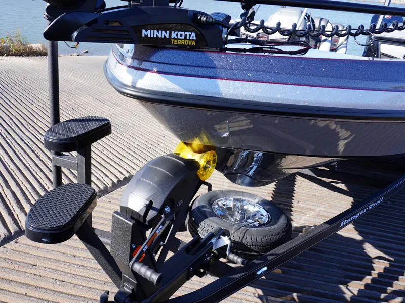 Slide: The Image of 2025 Ranger 2080MS boat with Minn Kota Terrova motor on a trailer at a boat ramp. - 21