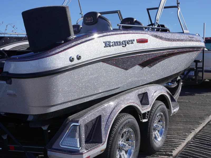 Slide: The Image of 2025 Ranger 2080MS boat on trailer, metallic finish, parked outdoors. - 3