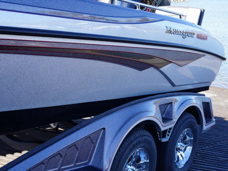 Slide: The Image of 2025 Ranger 2080MS boat on trailer, sleek design with metallic finish. - 4