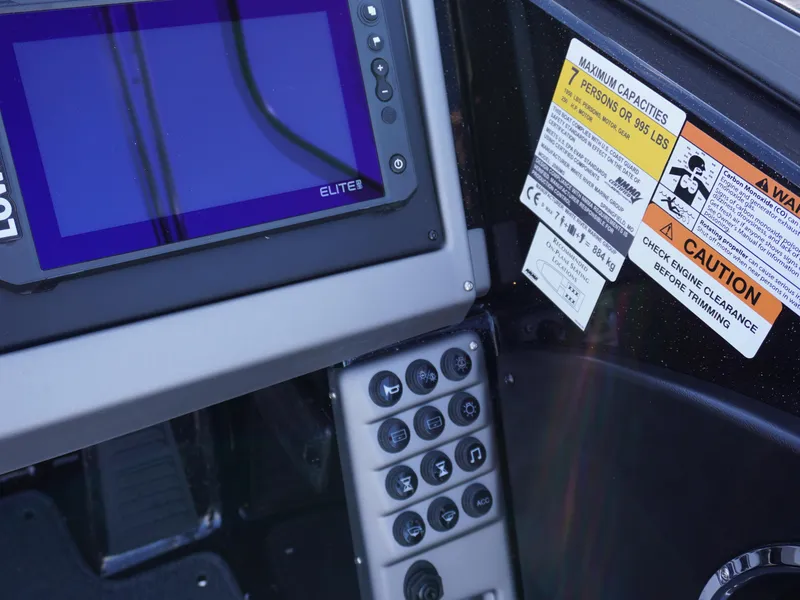 Slide: The Image of Control panel of 2025 Ranger 2080MS boat with display and warning labels. - 9