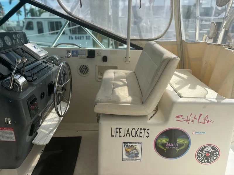 Slide: The Image of Interior of a 1995 Tiara Yachts 3600 Open, featuring helm and seating area. - 4