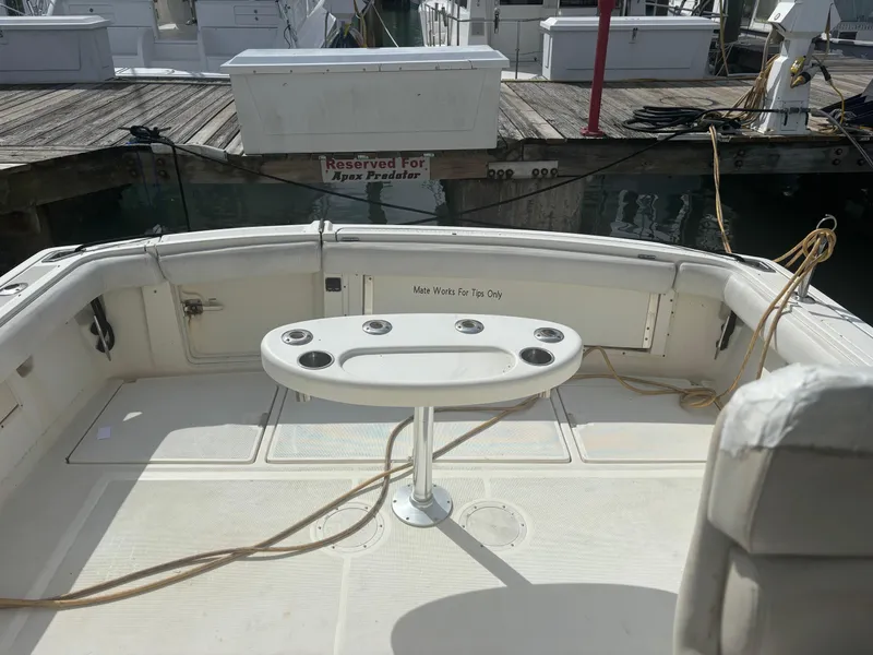 Slide: The Image of 1995 Tiara Yachts 3600 Open cockpit with fishing rod holders, docked at marina. - 6