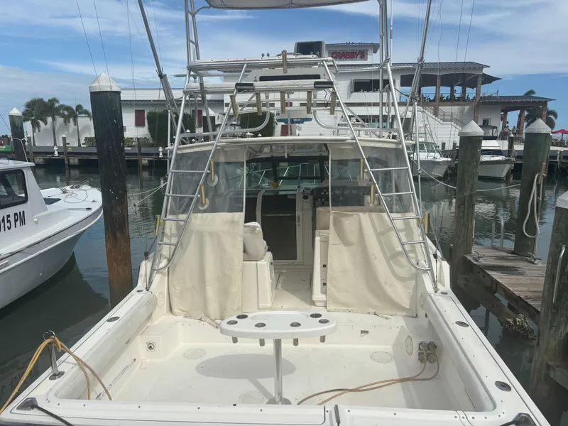 Slide: The Image of 1995 Tiara Yachts 3600 Open docked at marina, rear view. - 8