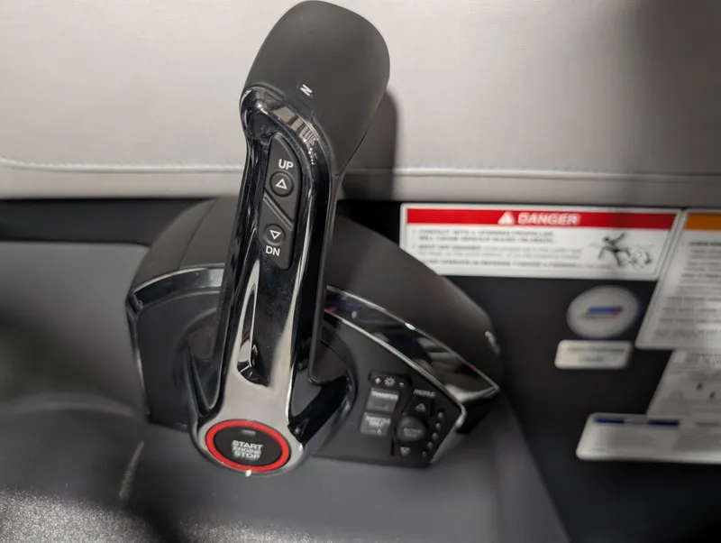 Slide: The Image of Control lever of 2025 Manitou 22 CRUISE boat, featuring start/stop button and up/down controls. - 10