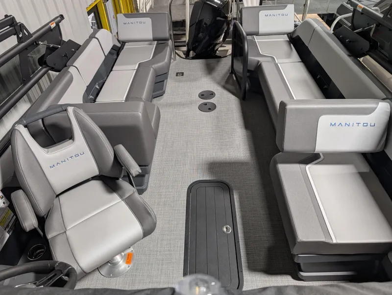 Slide: The Image of 2025 Manitou 22 CRUISE pontoon boat interior with gray seating and modern design. - 11