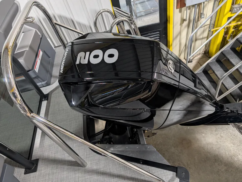 Slide: The Image of 2025 Manitou 22 CRUISE boat with a sleek black Mercury outboard motor. - 3