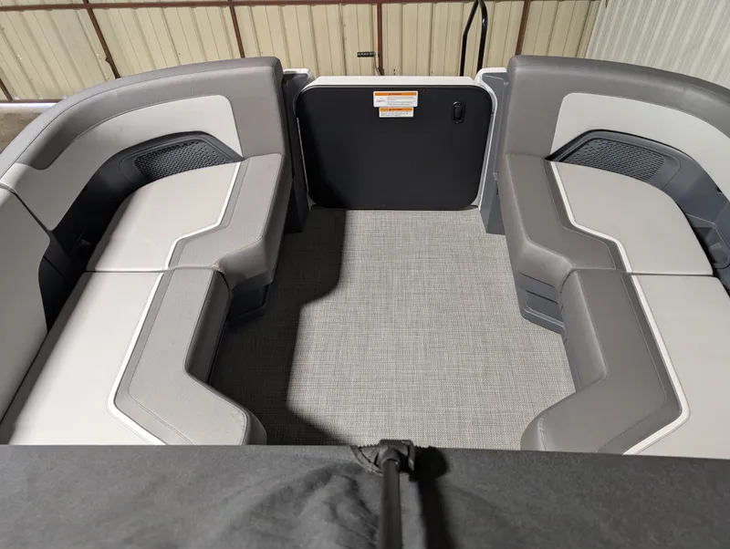 Slide: The Image of 2025 Manitou 22 CRUISE interior with gray seating and carpeted floor. - 7