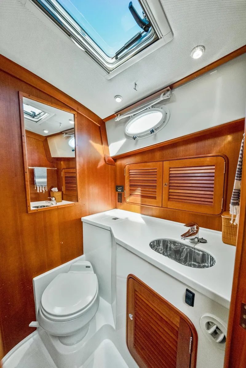 Slide: The Image of Luxurious 2008 Hinckley Talaria 44 yacht bathroom with wood accents and modern fixtures. - 11