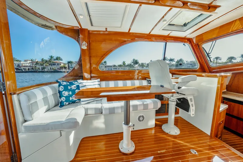 Slide: The Image of Luxurious interior of 2008 Hinckley Talaria 44 yacht with elegant seating and wooden finishes. - 3