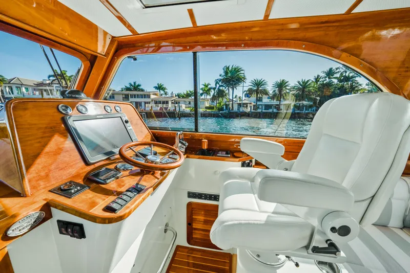 Slide: The Image of Interior of 2008 Hinckley Talaria 44 yacht with luxurious helm and waterfront view. - 4